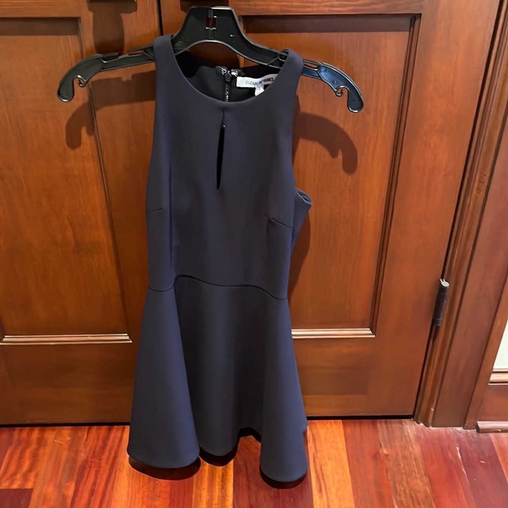 Dark navy dress. Size 2. Perfect condition! Zipper in back. Cutout in front.